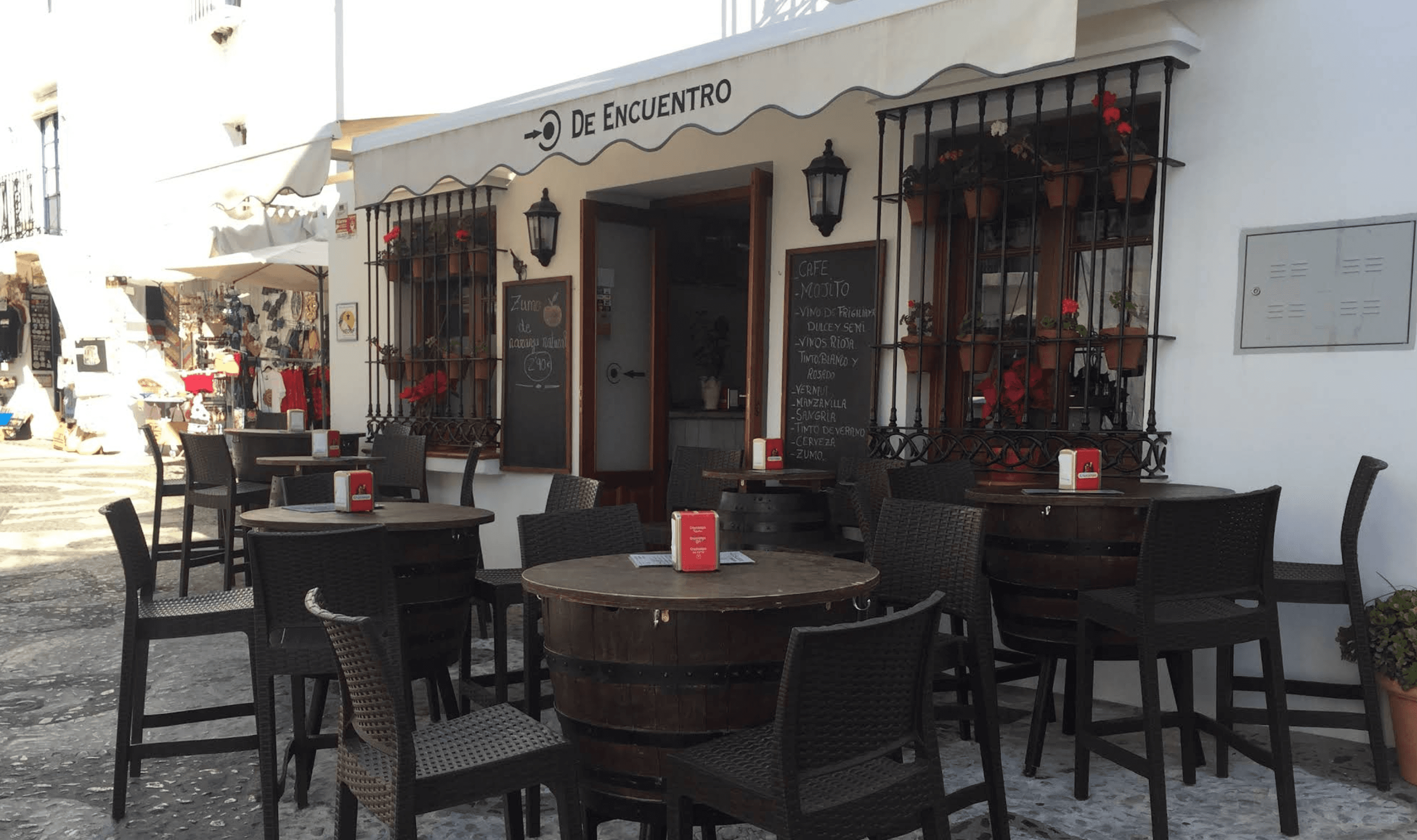Outdoor terrace seating at Punto de Encuentro in Frigiliana
